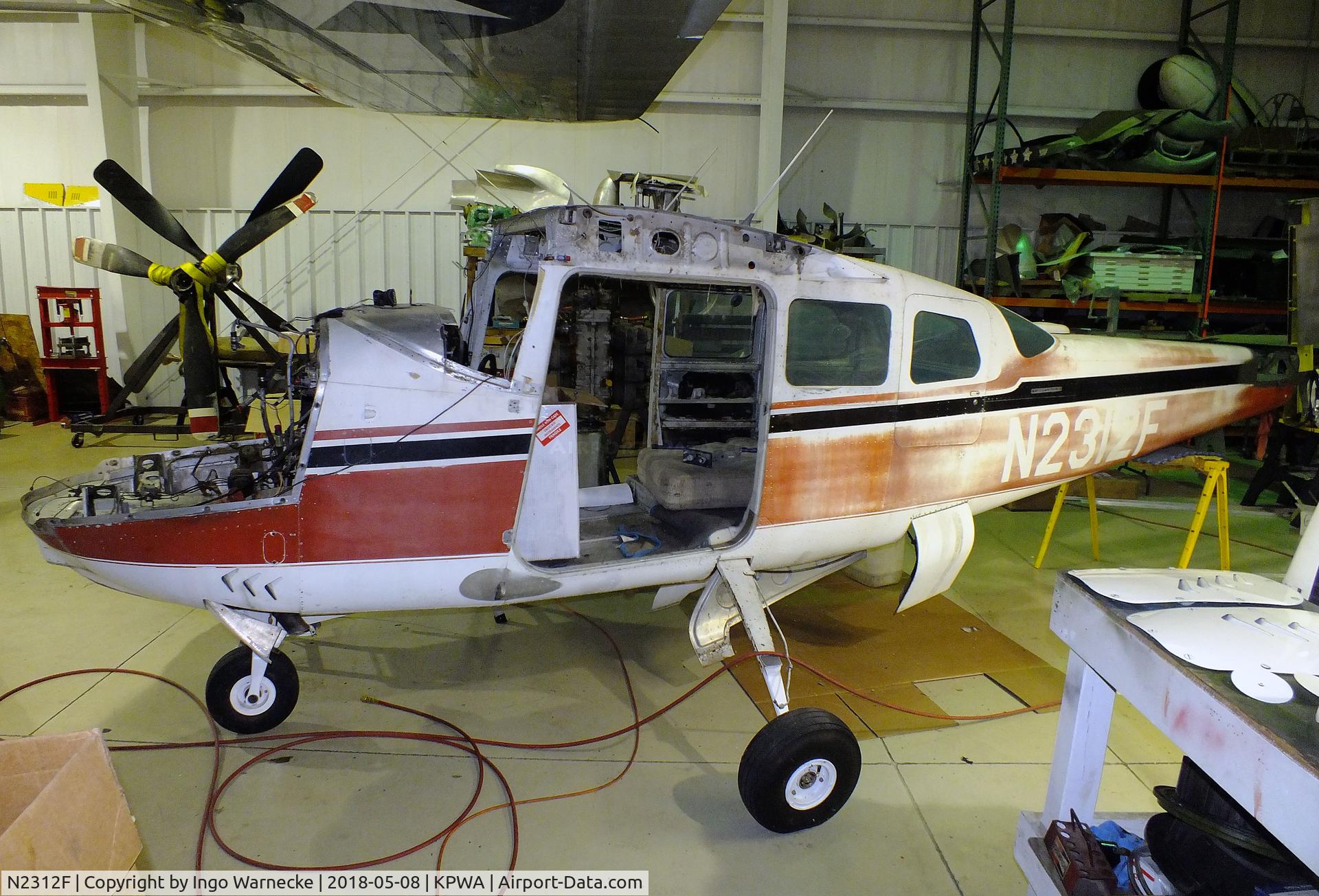 N2312F, 1964 Cessna 210E Centurion C/N 21058512, Cessna 210E Centurion, undergoing major maintenance at the Oklahoma Museum of Flying, Oklahoma City OK