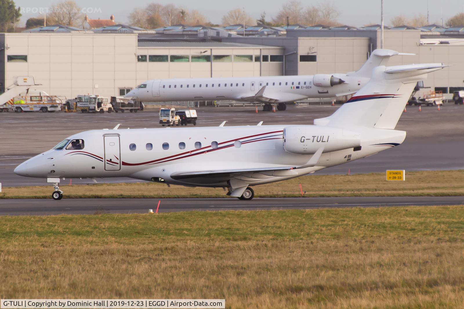 G-TULI, 2015 Embraer EMB-550 Legacy 500 C/N 55000031, Taxiing off of RWY 27 after landing