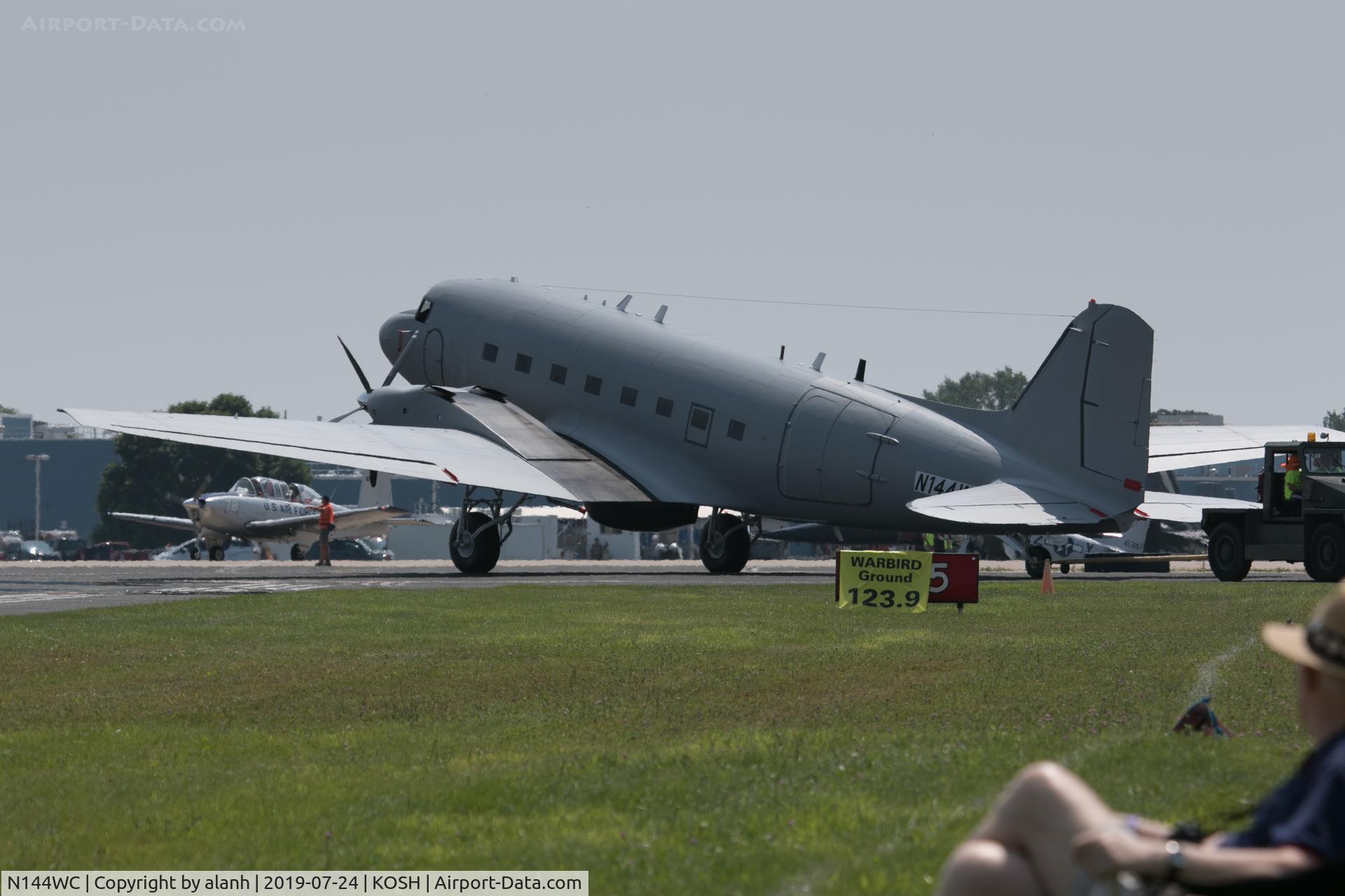 N144WC, 1944 Douglas DC-3C C/N 32843, On tow to the warbirds area at AirVenture 2019. This new Basler BT-67 turbo-conversion, still in primer and with taped on registration, probably should have a new database entry.