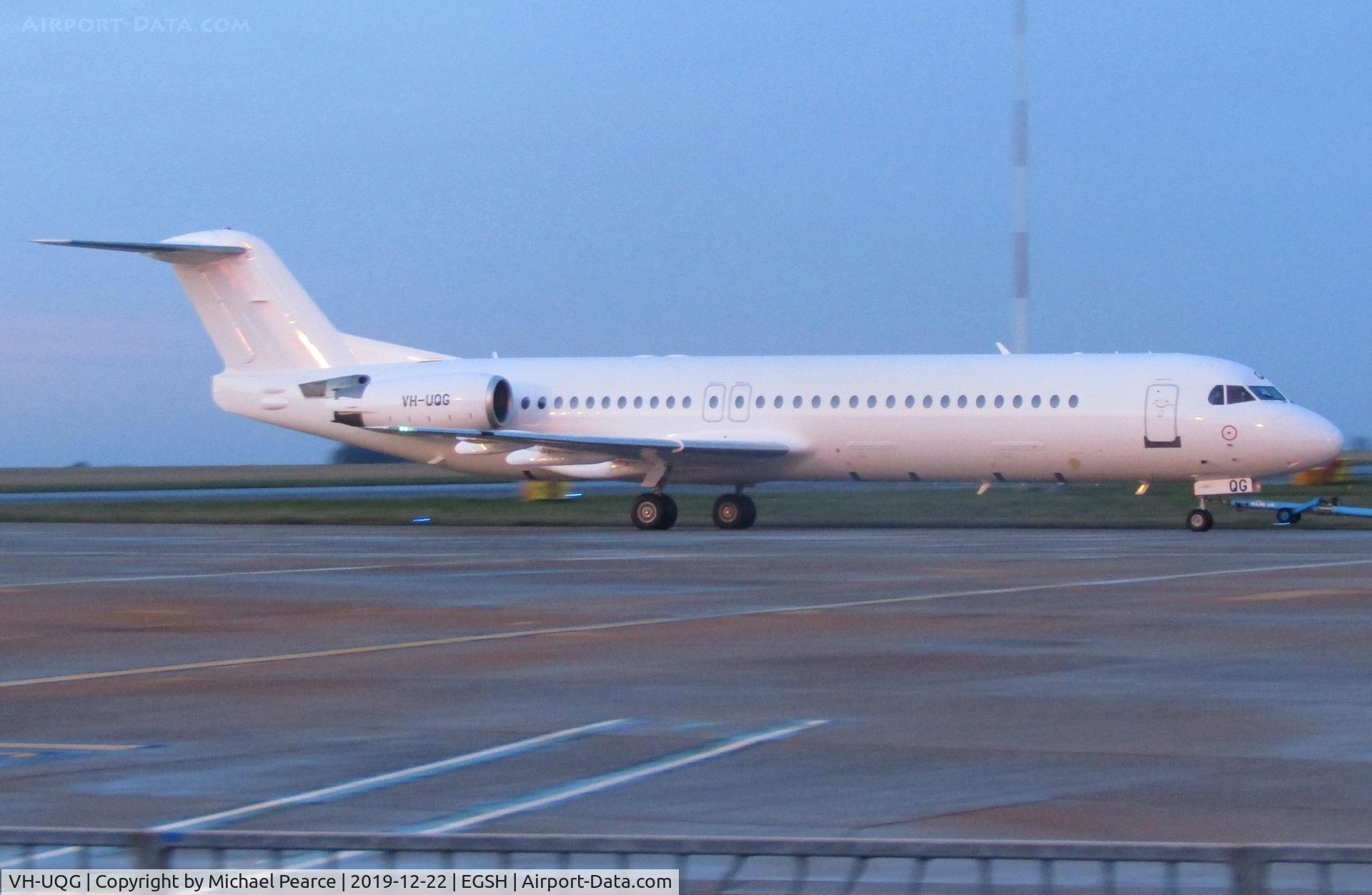 VH-UQG, 1994 Fokker 100 (F-28-0100) C/N 11520, Under tow by Air Livery for respray into the Sir Charles Kingsford Smith commemorative livery