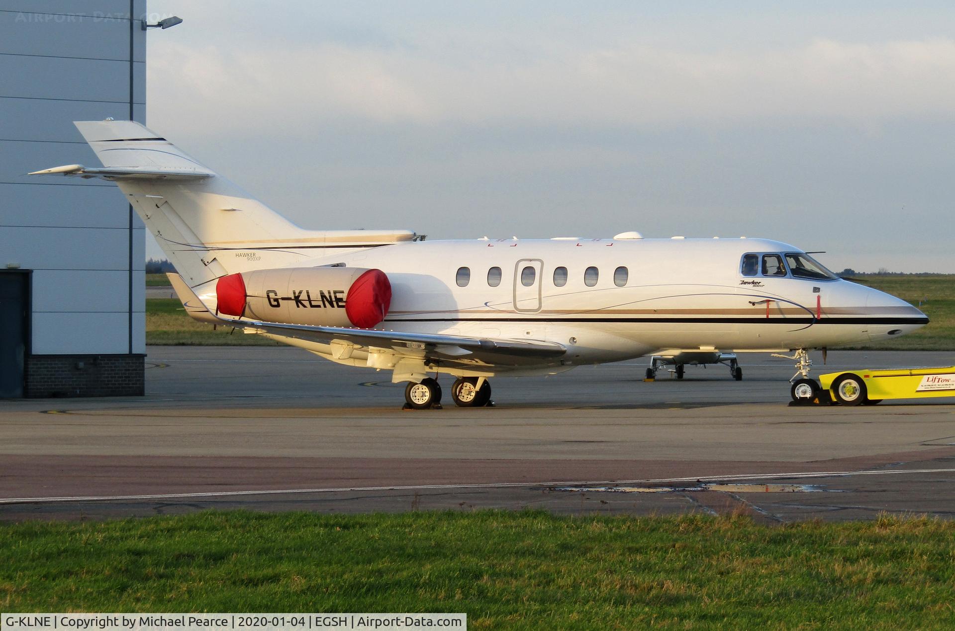 G-KLNE, 2011 Hawker Beechcraft 900XP C/N HA-0186, Parked on the company apron during a sunny winter evening.