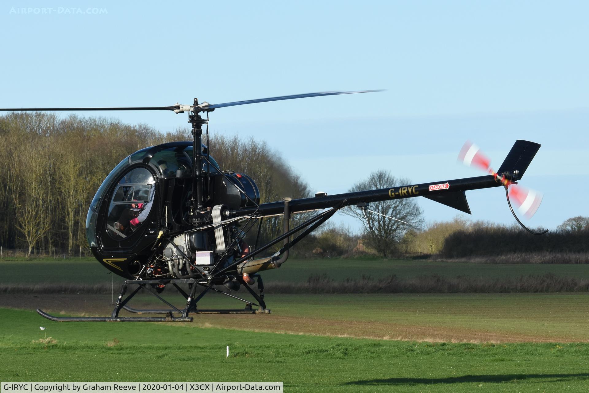 G-IRYC, 2004 Schweizer 269C-1 C/N 0194, Departing from Northrepps.