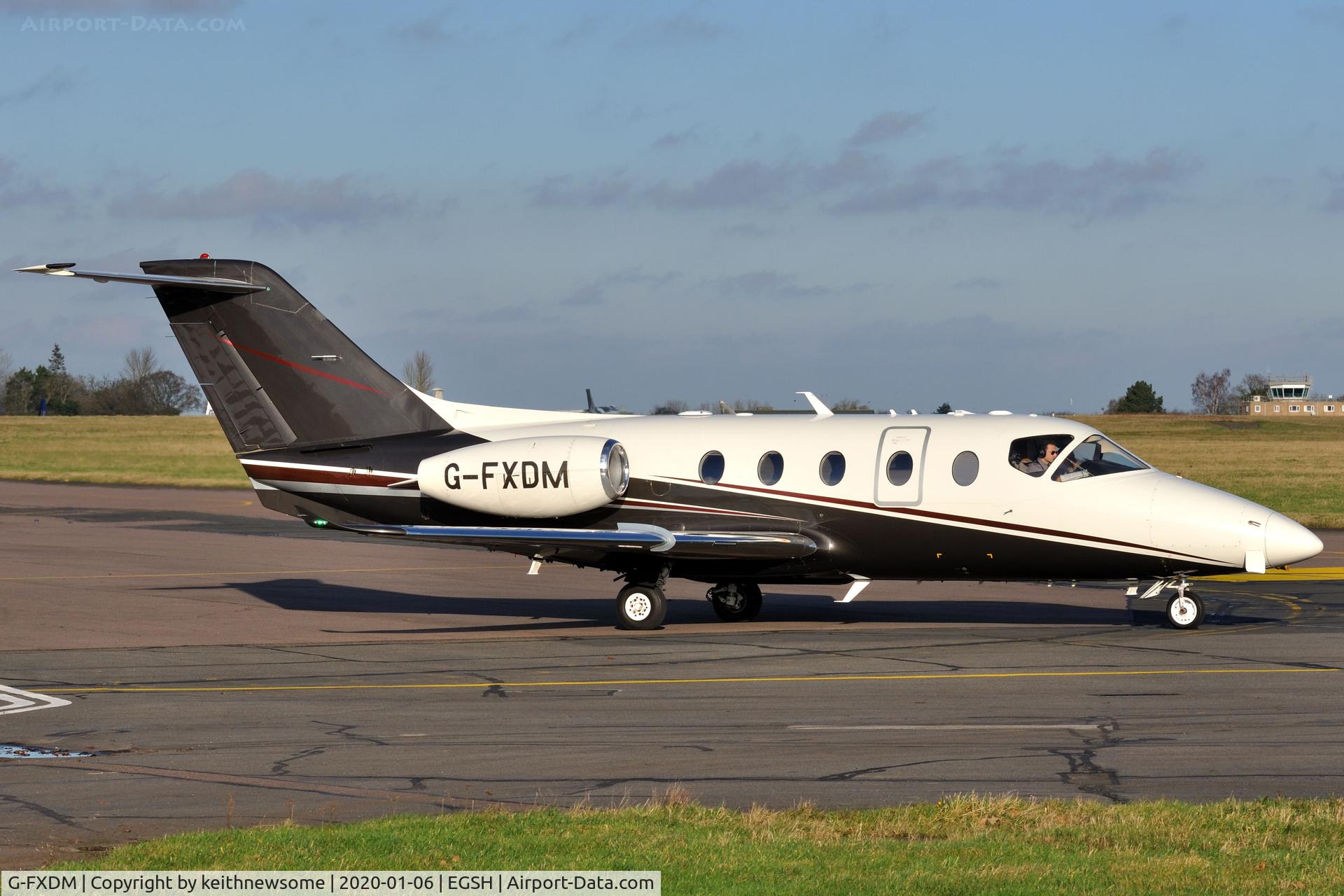 G-FXDM, 2004 Raytheon Beechjet 400A C/N RK-377, Leaving Norwich for Birmingham.