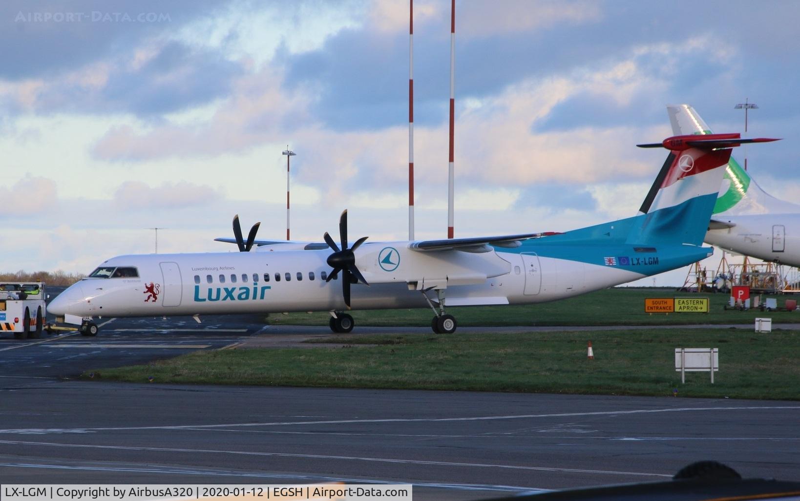 LX-LGM, 2012 De Havilland Canada DHC-8-402Q Dash 8 C/N 4425, Emerging from paint shop following a repaint at Norwich