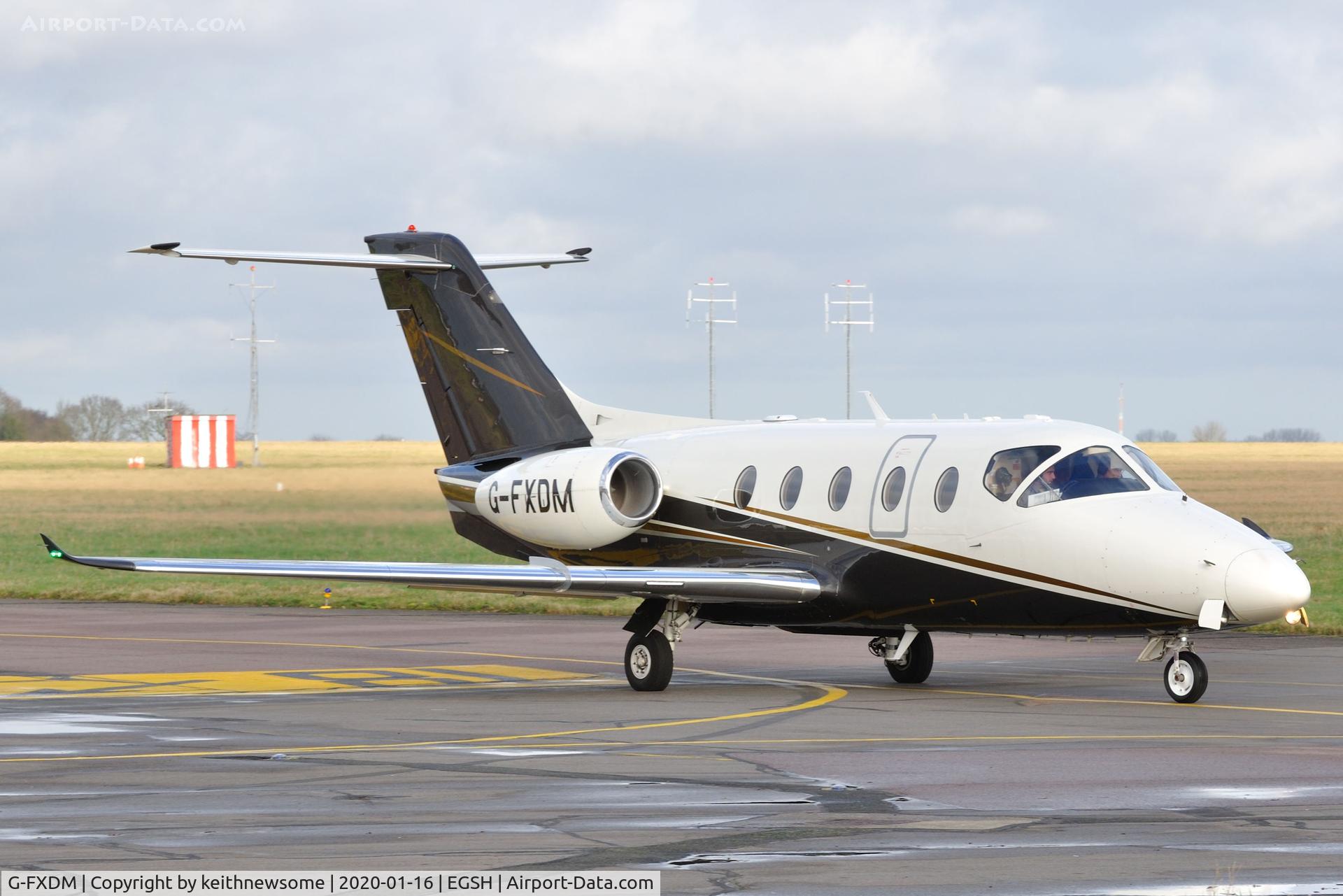 G-FXDM, 2004 Raytheon Beechjet 400A C/N RK-377, Leaving Norwich for Amsterdam.