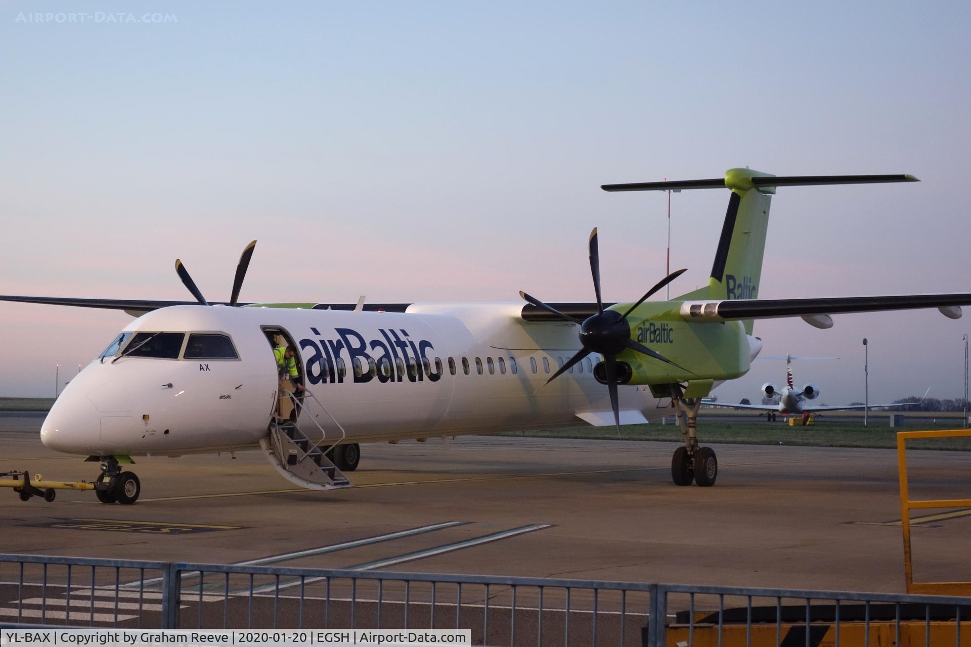 YL-BAX, 2010 De Havilland Canada DHC-8-402Q Dash 8 C/N 4324, parked on stand 