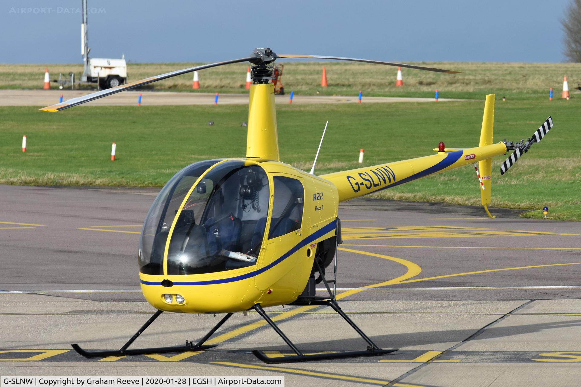 G-SLNW, 2003 Robinson R22 Beta II C/N 3524, Parked at Norwich.