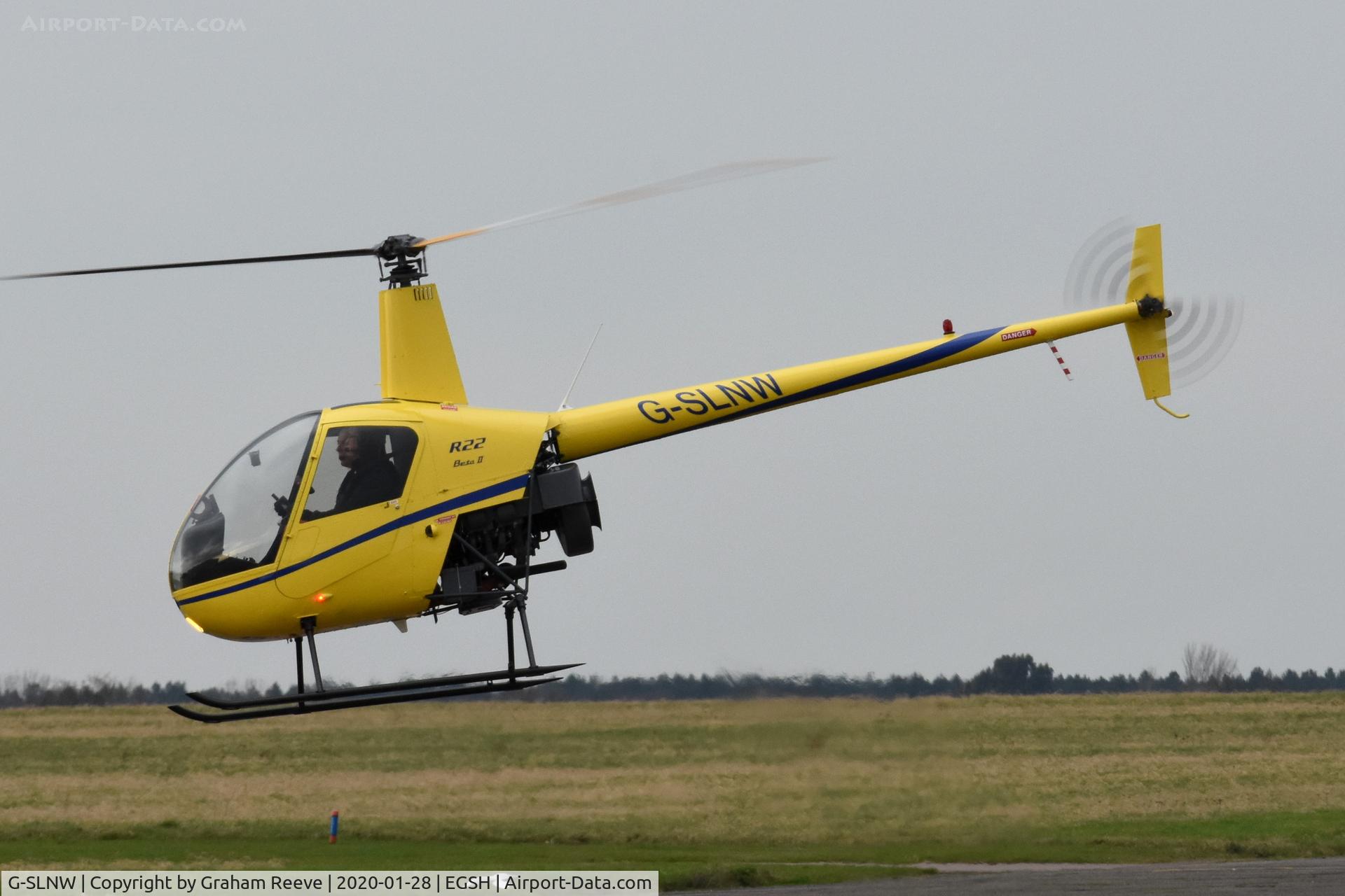 G-SLNW, 2003 Robinson R22 Beta II C/N 3524, Landing at Norwich.
