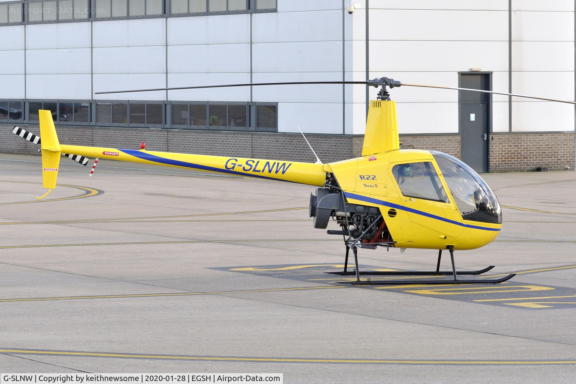 G-SLNW, 2003 Robinson R22 Beta II C/N 3524, Parked at Norwich.