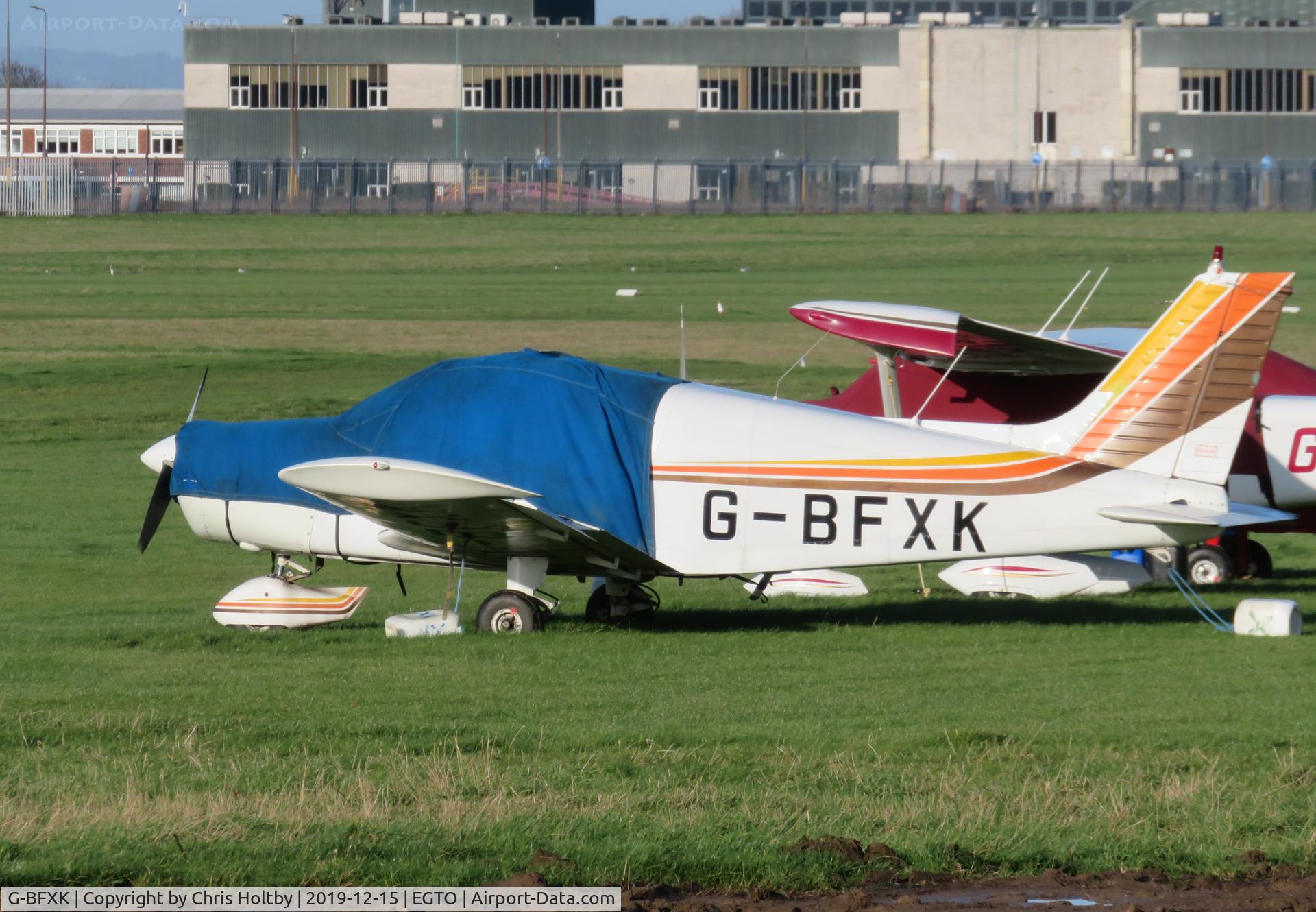 G-BFXK, 1973 Piper PA-28-140 Cherokee C/N 28-7325387, Parked at Rochester in the winter sun.