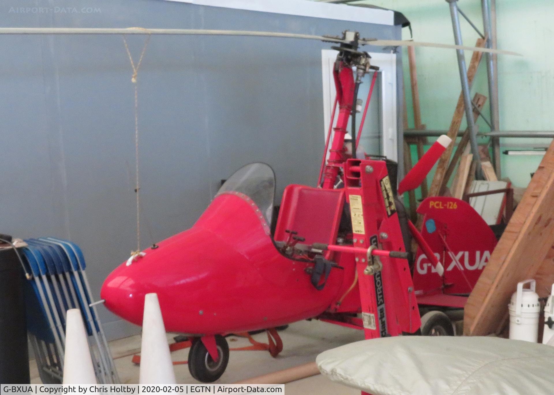 G-BXUA, 2000 Campbell Cricket MK5 C/N PFA G/03-1272, Campbell Mk5 Cricket tucked away at the back of the hangar at Enstone