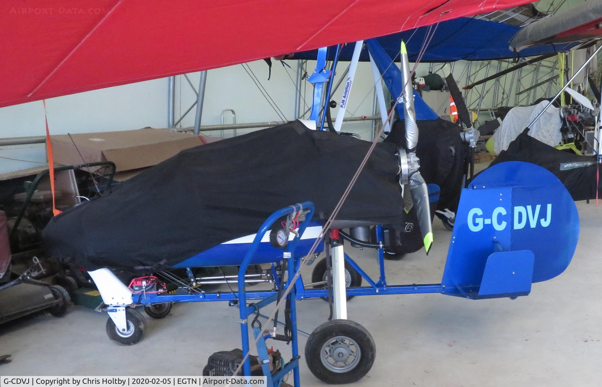 G-CDVJ, 2006 Montgomerie-Bensen B-8MR Gyrocopter C/N PFA G/01A-1355, Gyrocopter covered up in the hangar at Enstone Airfield Oxon.