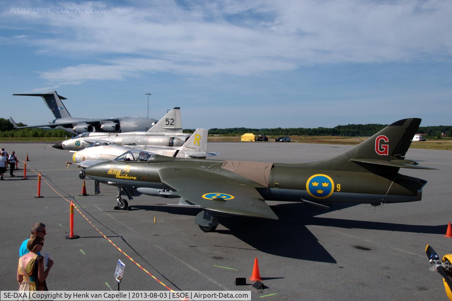 SE-DXA, Hawker Hunter F.58 C/N 41H-697456, Line-up of some of the aircraft on display during the 2013 Örebro Flyg & Motor Festival: Hawker Hunter, Saab J29 Tunnan, Saab AJ37 Viggen and a NATO C-17A Globemaster III.