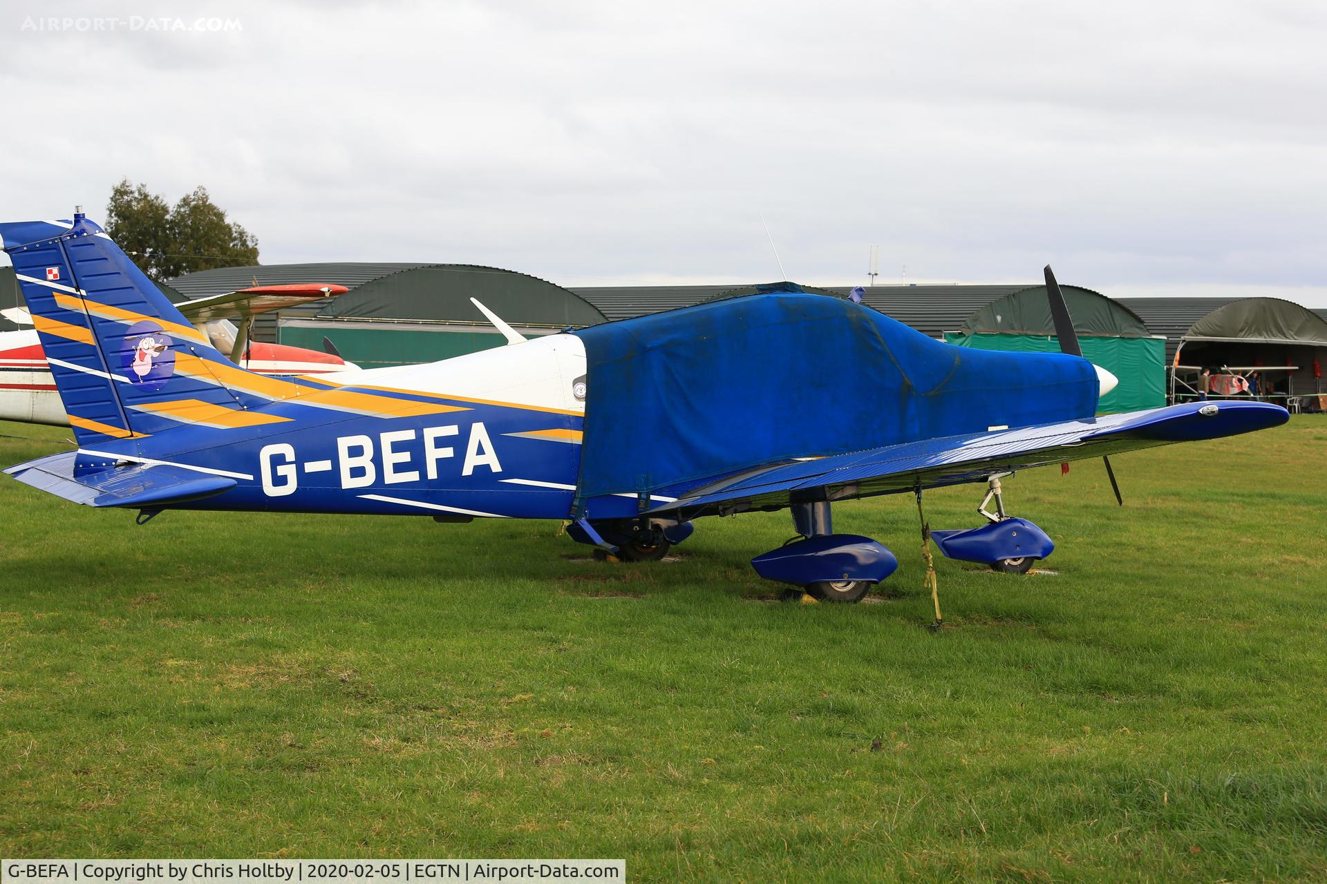 G-BEFA, 1976 Piper PA-28-151 Cherokee Warrior C/N 28-7615416, Parked and covered at Enstone Airfield Oxon