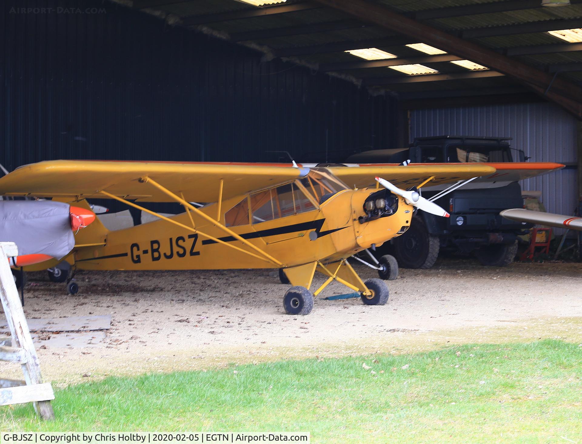 G-BJSZ, 1944 Piper L-4H Grasshopper (J3C-65D) C/N 11874, 1948 Grasshopper hangared at Enstone Airfield