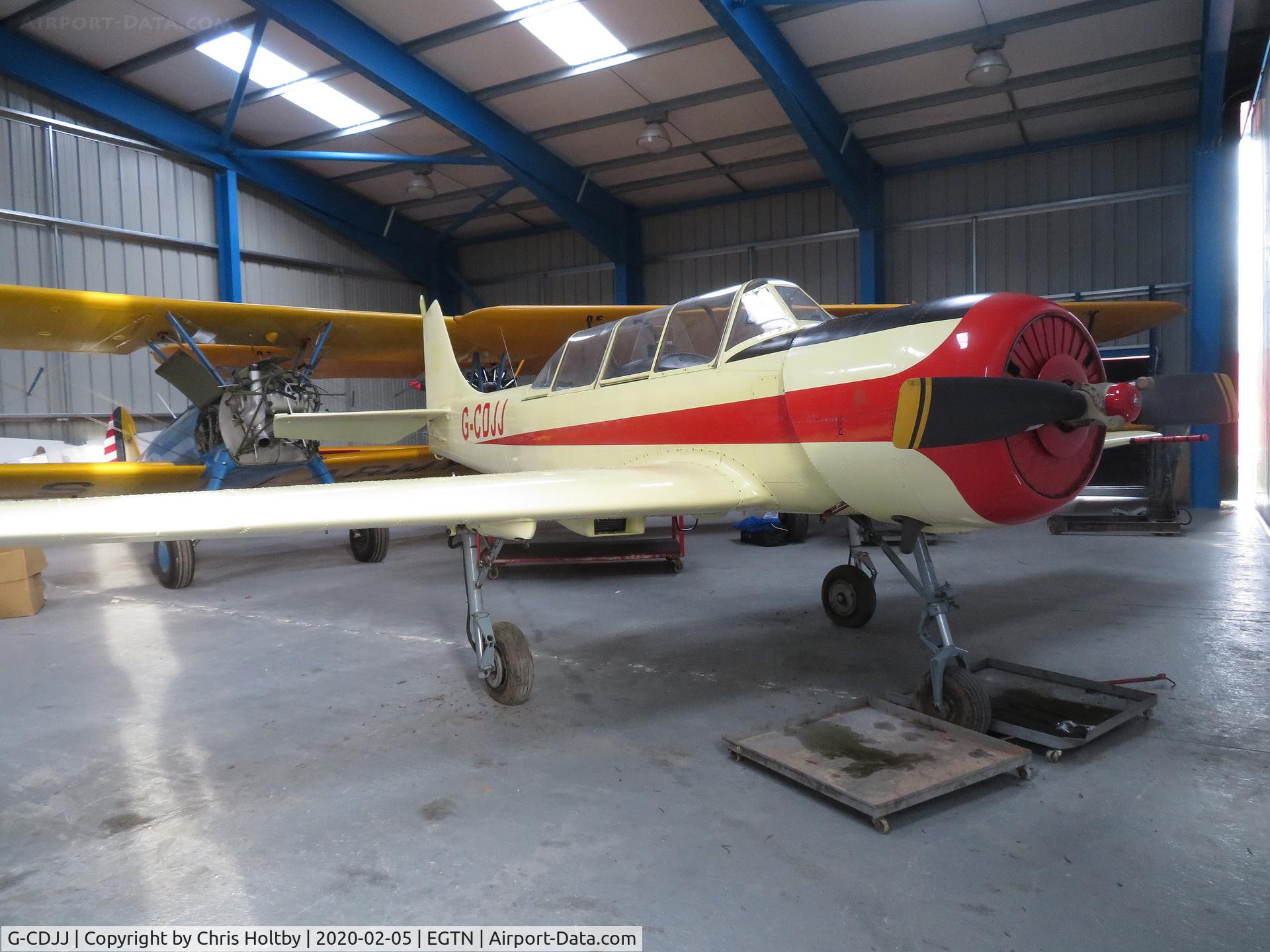 G-CDJJ, 1989 Bacau Yak-52 C/N 899912, Pristine Yak 52 hangared at Enstone Airfield, Oxon. Owned by a Bicester company Digitakumi Ltd.