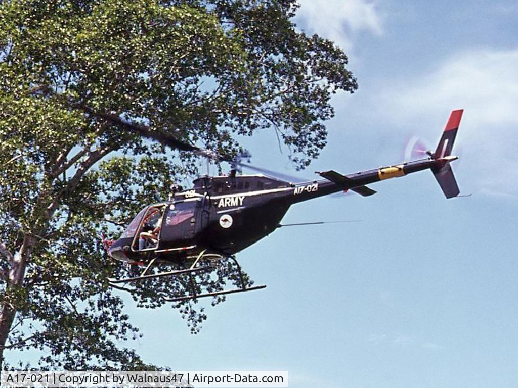 A17-021, 1974 Commonwealth CA-32 Kiowa C/N 44521, Aust Army CA-32 / Bell 206B-1 A17-021 Cn 44521 departs Igam Barracks Lae TPNG, close to a large tree in Feb 1975. Delivered 1974. Crashed 1995, after loss of Loss of Tailrotor Effectiveness (LTE) during landing at Gibb River, WA.