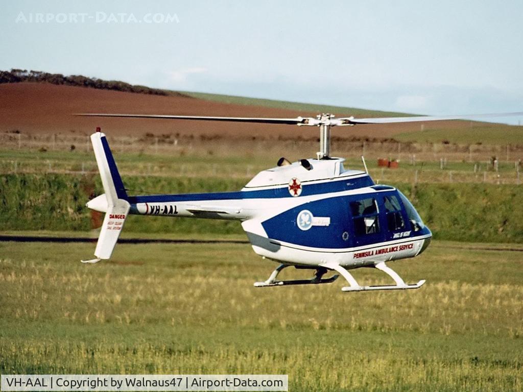 VH-AAL, 1970 Bell 206B C/N 606, Rear Stbd hover view - Vowell Air Services / Peninsula Ambulance Service Bell 206A VH-AAL Cn 606 (later upgraded to B206B Spec) Phillip Island (Race track) Feb 1971 - Angel of Mercy – PIARC Medevac standby. Low res image.