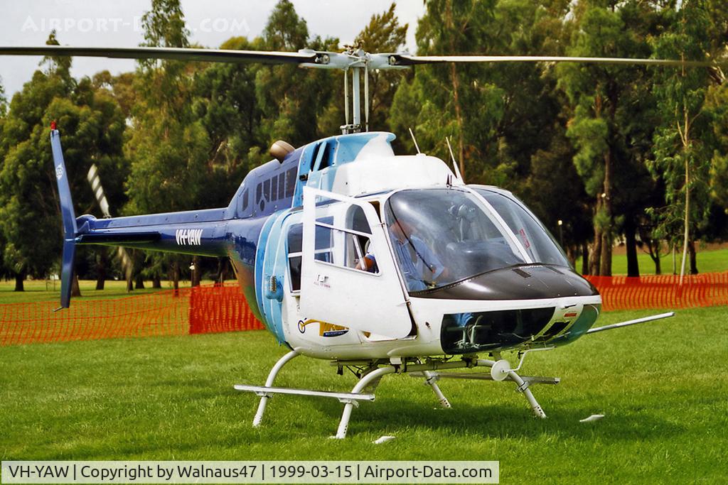 VH-YAW, 1973 Bell 206B Jetranger II C/N 942, Close-cropped front Stbd side view of Virgin Helicopters ACT Bell 206B JetRanger VH-YAW Cn 942 winding down (with rotors turning) close to Lake Burley Griffin Canberra during Canberra Week festivities on 15Mar1999 (Canberra Day).
