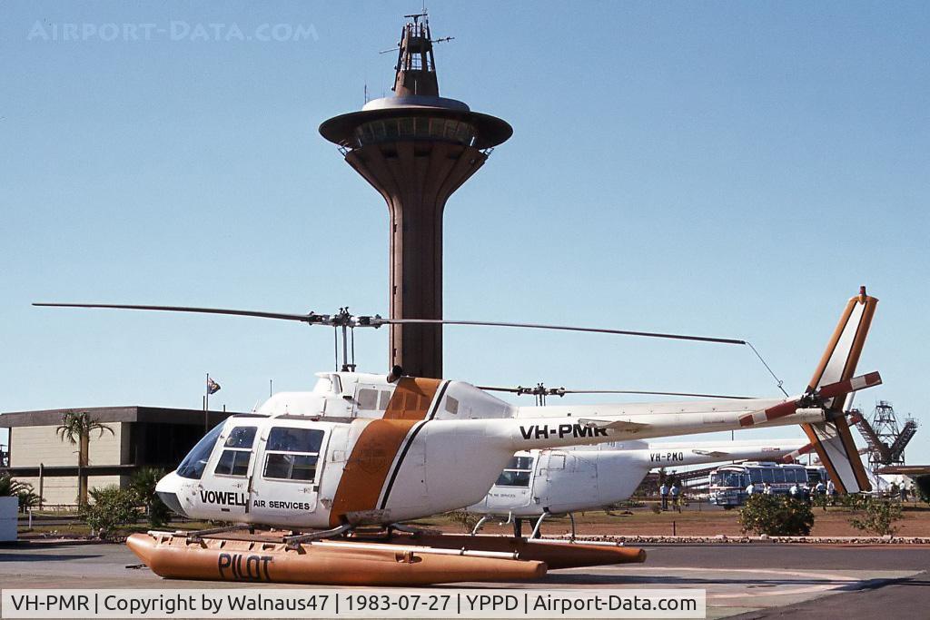 VH-PMR, Bell 206B JetRanger II C/N 358, Port side view of Vowell Port Hedland 'Port Pilots' Bell 206B JetRanger II VH-PMR Cn 358 (on fixed floats and transport trolley) on the Port Authority helipad YPPD on 27Jul1983. As VH-CSH the helo crashed near Dunedoo NSW on 22Nov2004.