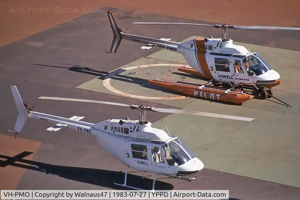 VH-PMO, 1970 Bell 206A JetRanger C/N 549, View of Port Hedland 'Port Pilots' Vowell Bell 206B JetRanger II VH-PMO Cn 549 and VH-PMR Cn 358 at rear (on fixed floats and transport trolley) on the Port Authority helipad YPPD on 27Jul1983. (Photo taken from the Port Authority Control Tower.)
