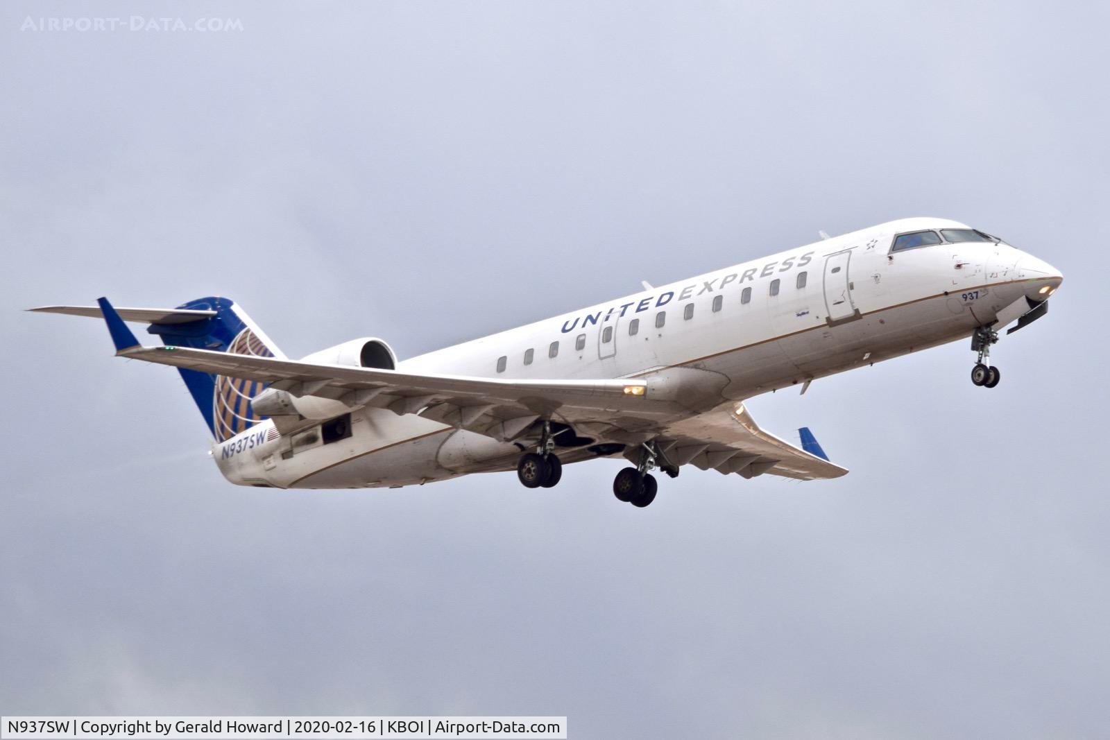 N937SW, 2003 Bombardier CRJ-200LR (CL-600-2B19) C/N 7735, Climb out from 28R.