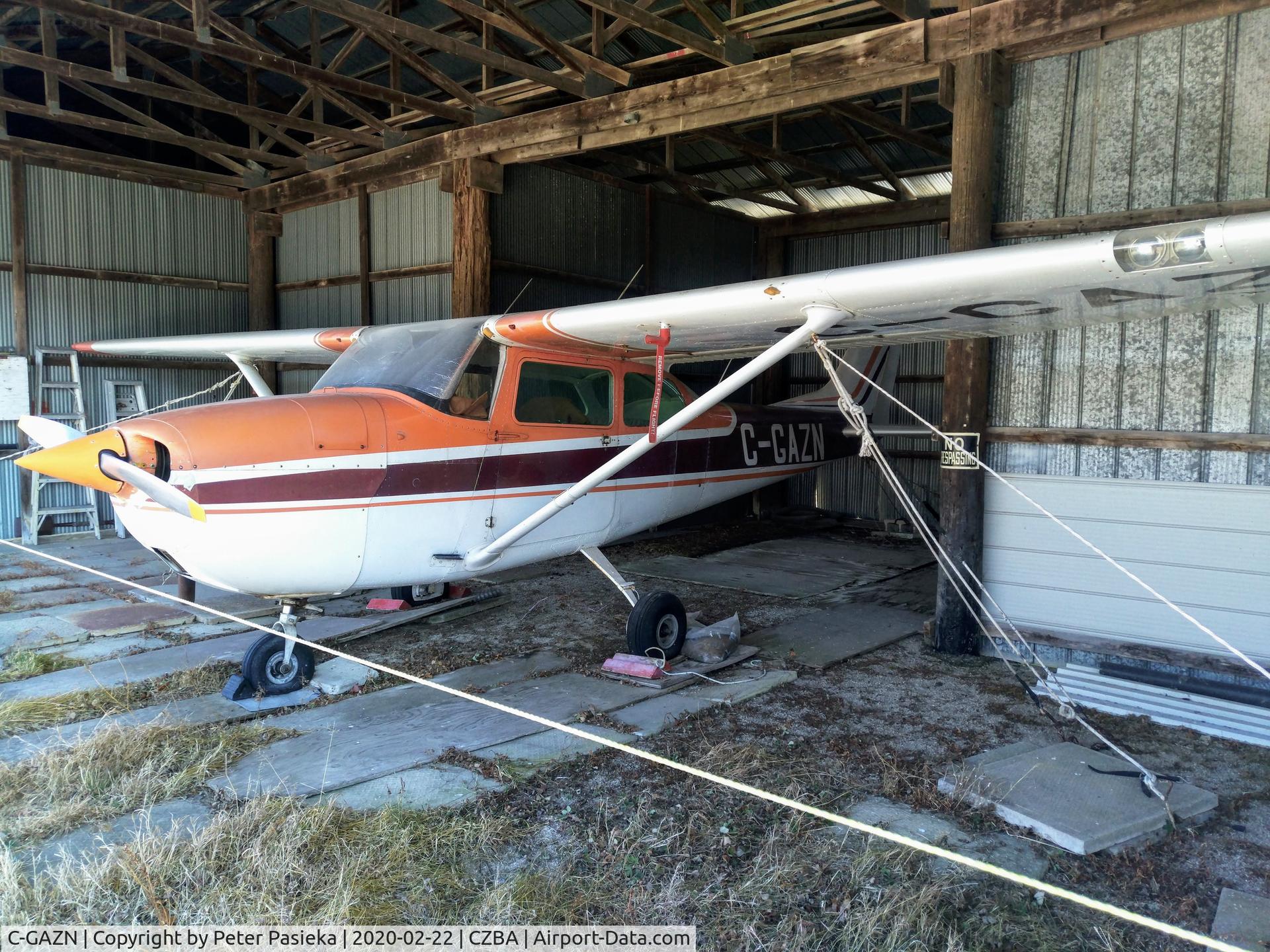 C-GAZN, 1969 Cessna 172K Skyhawk C/N 17257191, Sad looking Cessna sitting in a hangar at Burlington Airport.