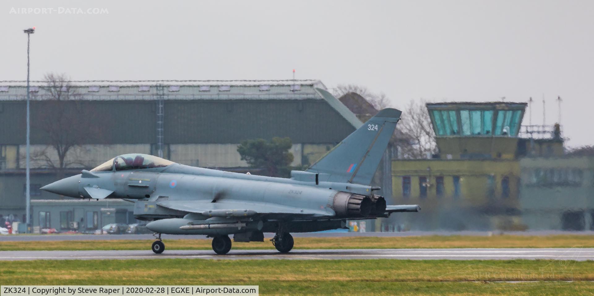ZK324, 2011 Eurofighter EF-2000 Typhoon FGR4 C/N BS085/324, A very rainy RAF Leeming. Returning after a NATO exercise sortie. The old tower in the background.
