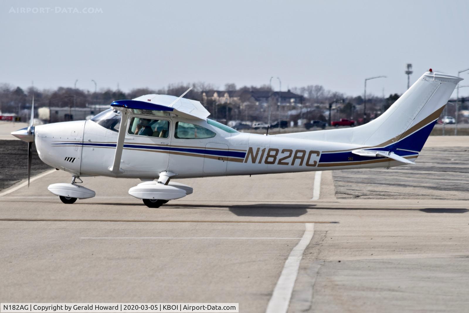 N182AG, 1973 Cessna 182P Skylane C/N 18262401, Taxiing off the north GA ramp.