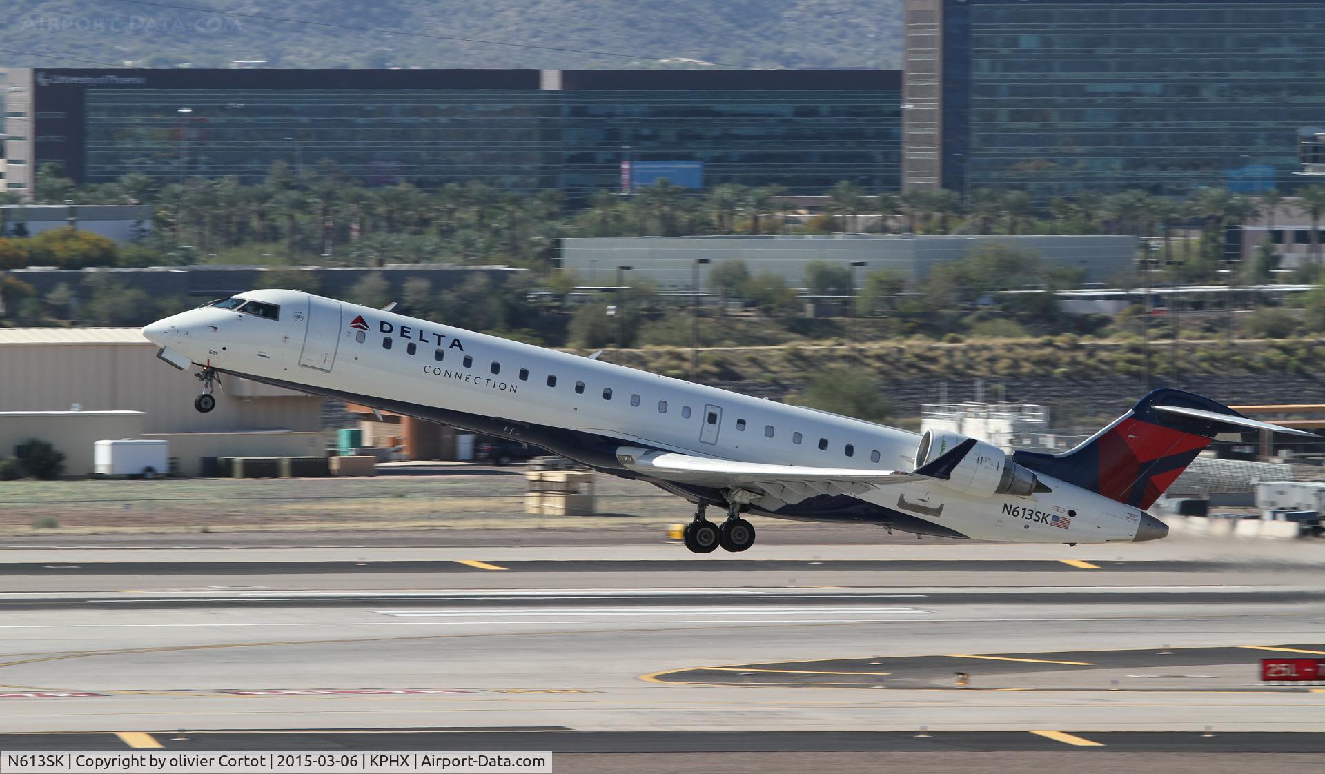 N613SK, 2002 Bombardier CRJ-701 (CL-600-2C10) Regional Jet C/N 10038, taking off from phoenix