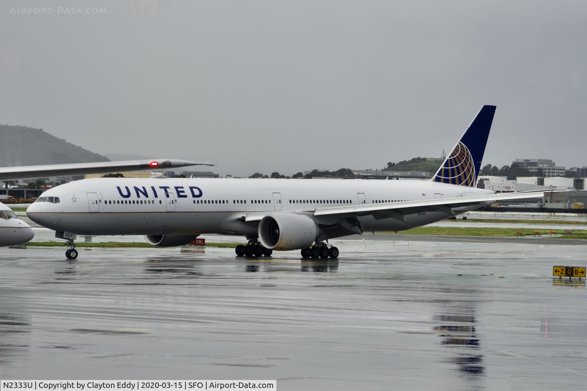 N2333U, 2016 Boeing 777-300/ER C/N 62644, Rainy morning SFO 2020.