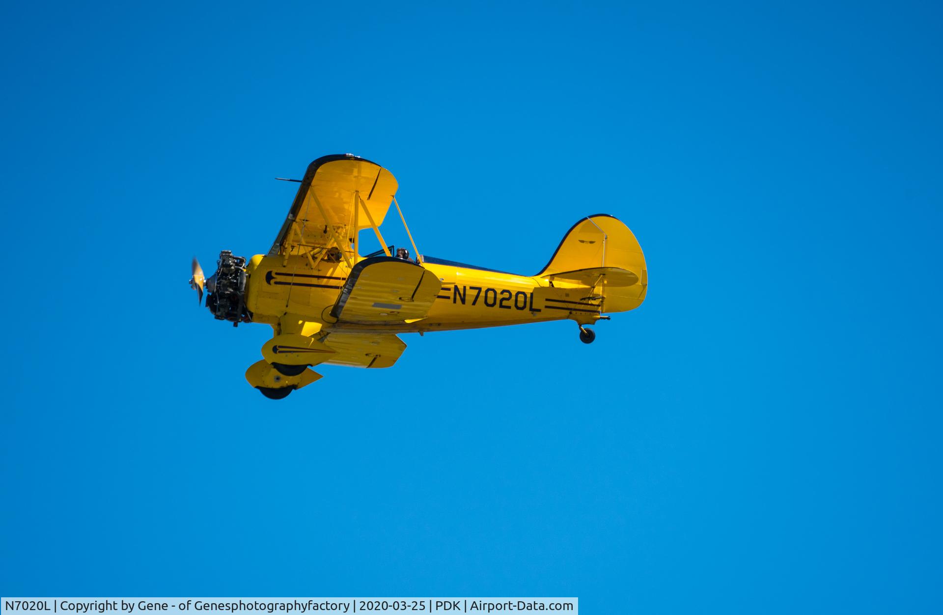 N7020L, 1999 Waco YMF-F5C C/N F5C085, Beautiful WACO bi-plane that offers rides to customers.  Jet blue skies today with its nice contrasting yellow airframe.  Awesome!  This was shot a Peachtree-Dekalb Airport (KPDK) just north of Atlanta, Georgia.