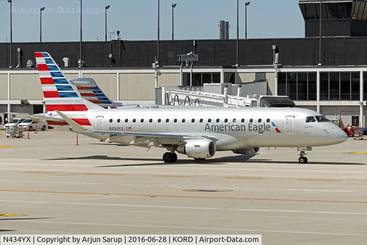 N434YX, 2014 Embraer 175LR (ERJ-170-200LR) C/N 17000418, Taxiing by at Chicago.