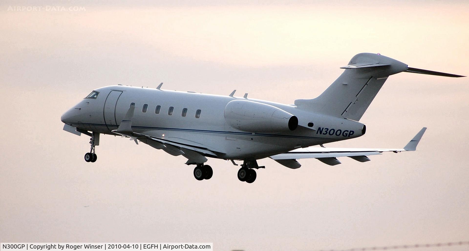 N300GP, Bombardier Challenger 300 (BD-100-1A10) C/N 20253, Visiting Challenger 300 departing Runway 22 at dusk.