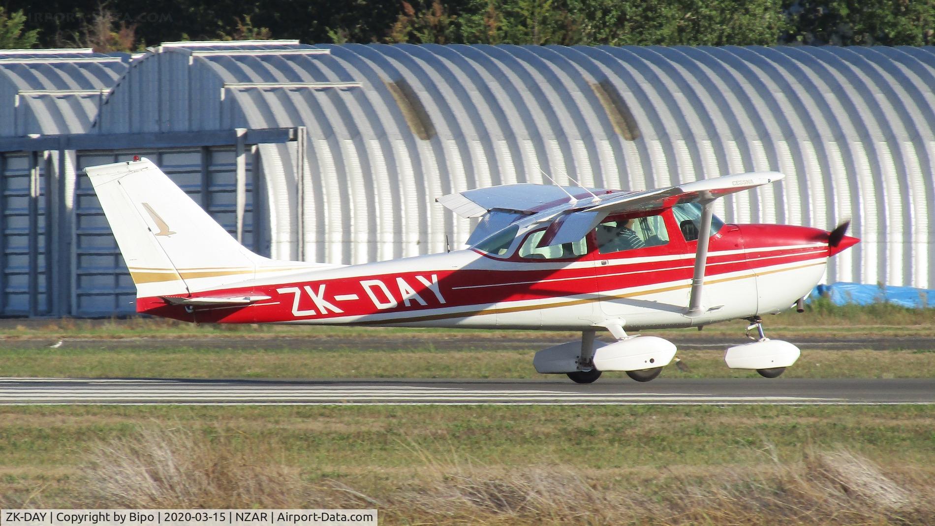 ZK-DAY, Cessna 172L C/N 17259825, Touching down one evening at Ardmore.