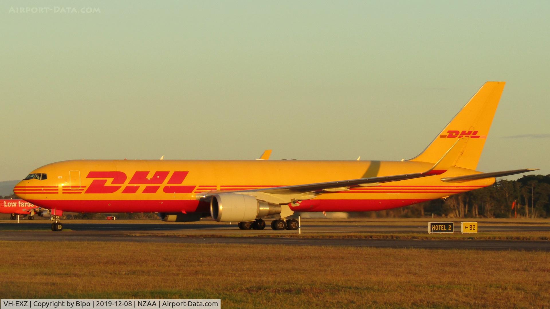 VH-EXZ, 2012 Boeing 767-3JH/F/ER C/N 37808, Taxiing out to the DHL/Tasman Cargo apron after arrival from Sydney.