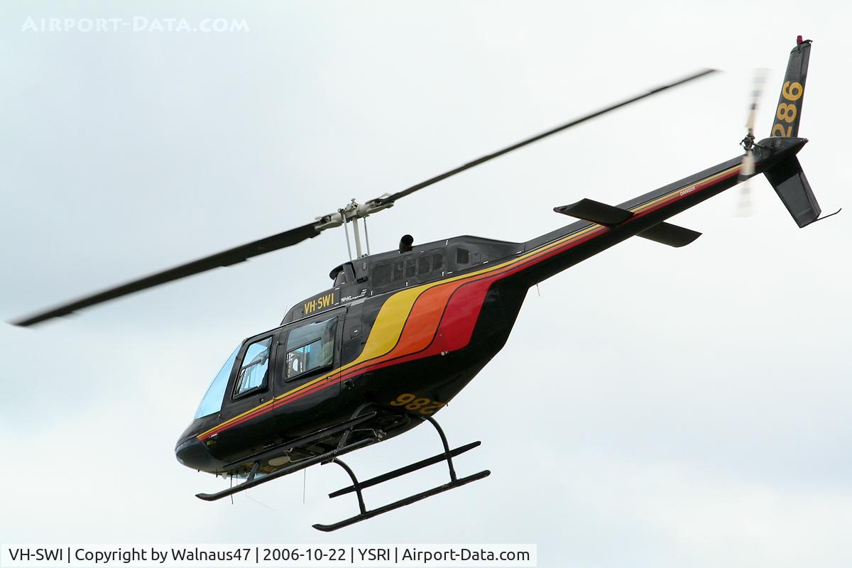 VH-SWI, 1978 Bell 206B-3 JetRanger III C/N 2324, Rear Port-side view of black ‘JoyFlight’ Bell 206B JetRanger III helicopter VH-SWI Cn 2324 Firebird 286 departing RAAF Base Richmond YSRI NSW during the Australian Defence Force Airshow on 22Oct2006.