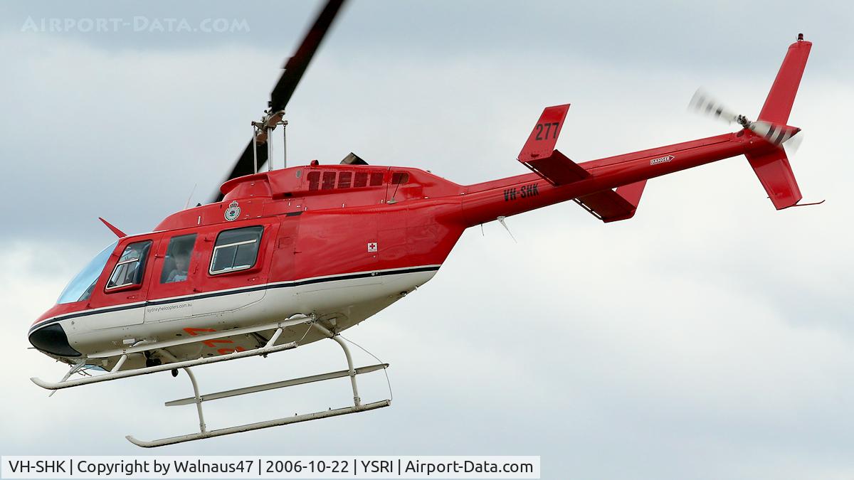 VH-SHK, 1979 Bell 206L-1 LongRanger II C/N 45323, Close-cropped rear Port-side view of ‘JoyFlight’ Sydney Helicopters Bell 206L-1 LongRanger helicopter VH-SHK Cn 45323 Firebird 277 departing RAAF Base Richmond YSRI NSW during the Australian Defence Force Airshow on 22Oct2006.