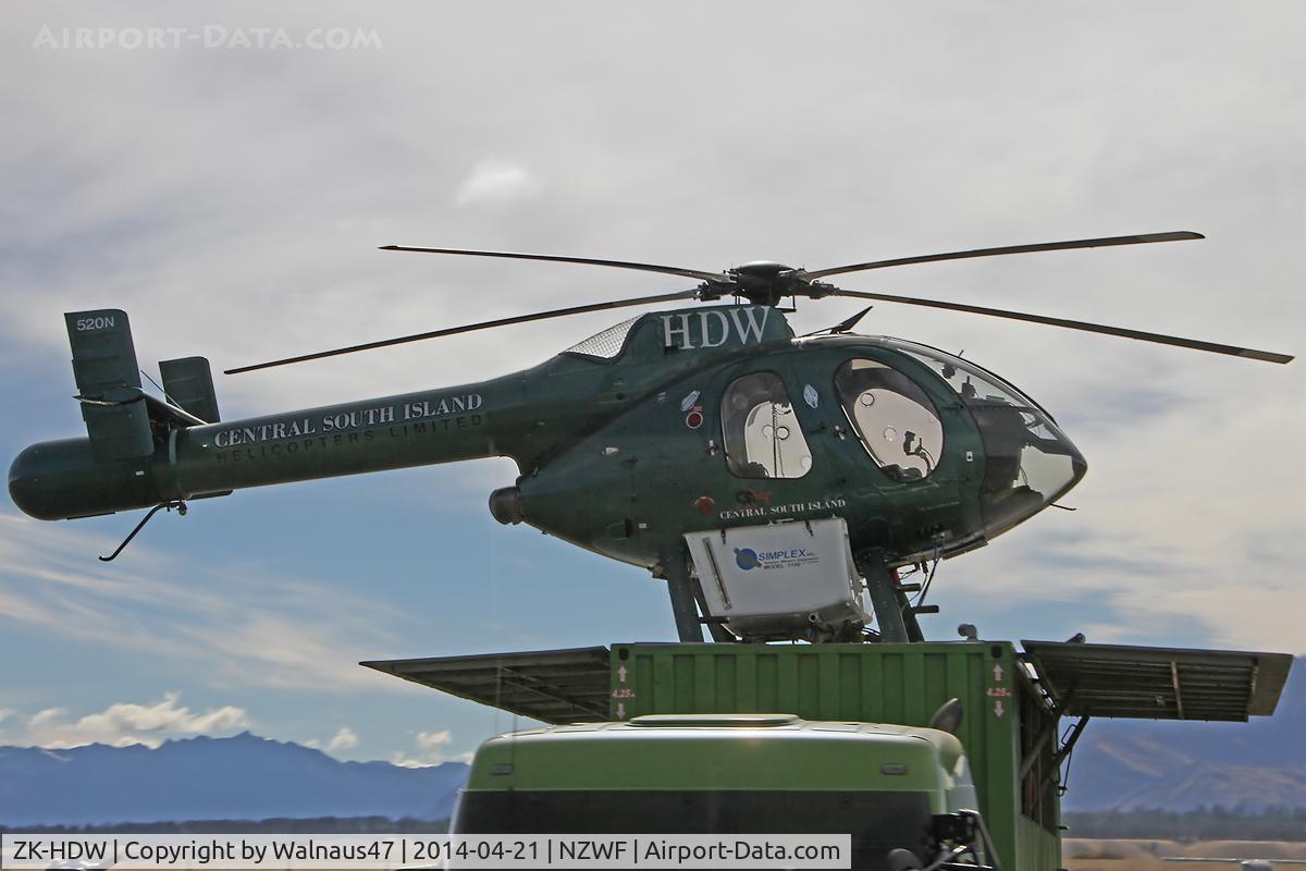 ZK-HDW, McDonnell Douglas 500N C/N LN072, Stdb side view of McDonnell Douglas 500N ZK-HSH CN LN072 at Wanaka NZWF on 21Apr2014, during Warbirds Over Wanaka (WOW) 2014. The helo is equipped with spray gear, and it operated from the roof of a large Trailer.
