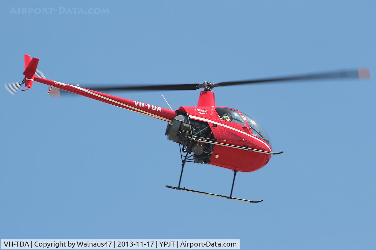 VH-TDA, 2012 Robinson R22 C/N 4584, Rear Stbd side view of red livery Robinson R22 Beta VH-TDA Cn 4584 transiting at Jandakot YPJT, Perth, West Australia, on 17Nov2013.