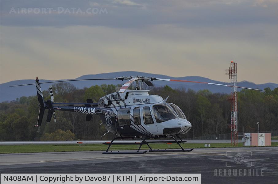 N408AM, 2000 Bell 407 C/N 53445, Parked on the ramp in front of Tri-Cities Aviation at Tri-Cities Airport (KTRI) 09Apr20