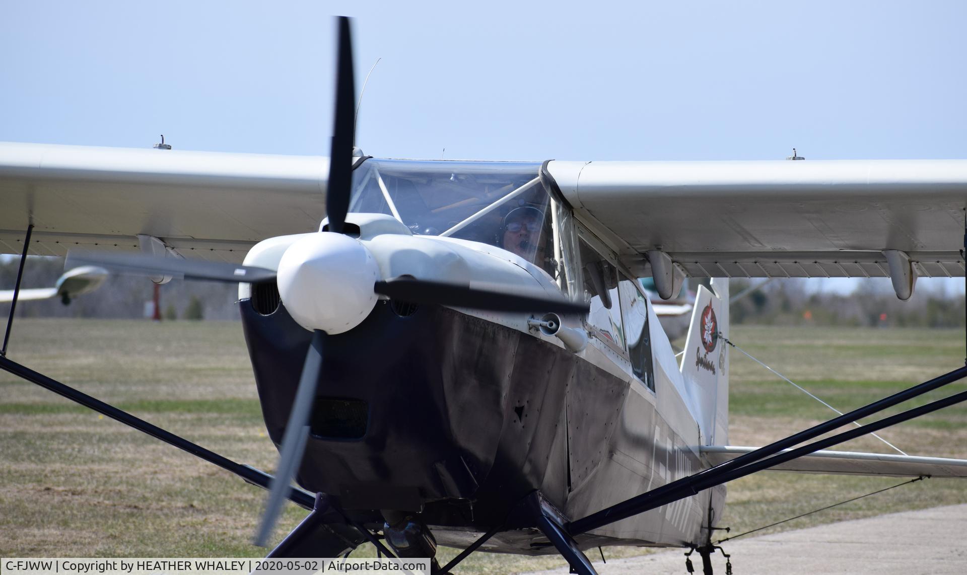 C-FJWW, 2003 Wag-Aero Sportsman 2+2 C/N 932, Taxiing towards the hangar at Smiths Falls Flying Club.  The builder of this plane is also the pilot at the controls.