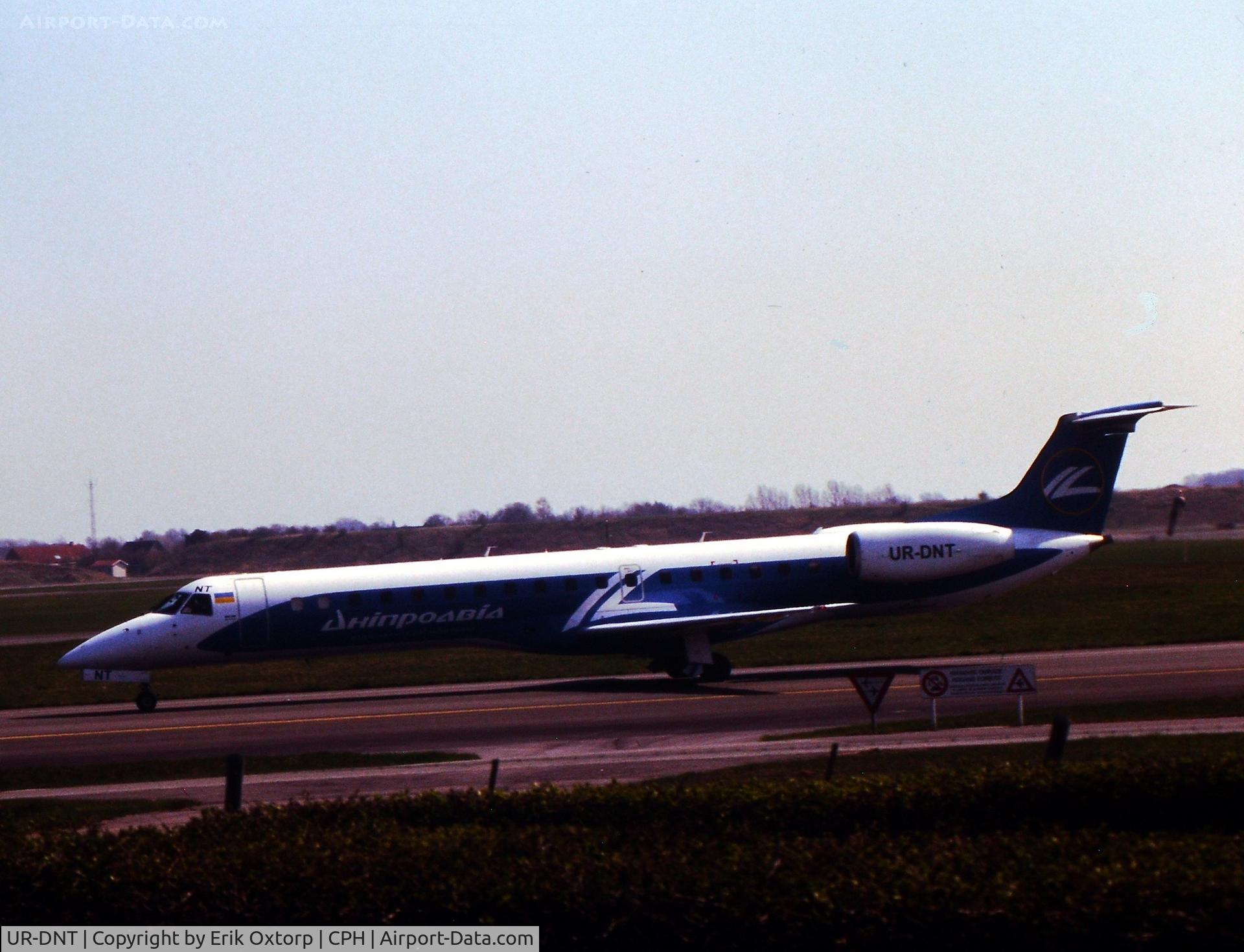 UR-DNT, 2003 Embraer ERJ-145LR (EMB-145LR) C/N 145709, UR-DNT landed rw 04L
Scanned slide