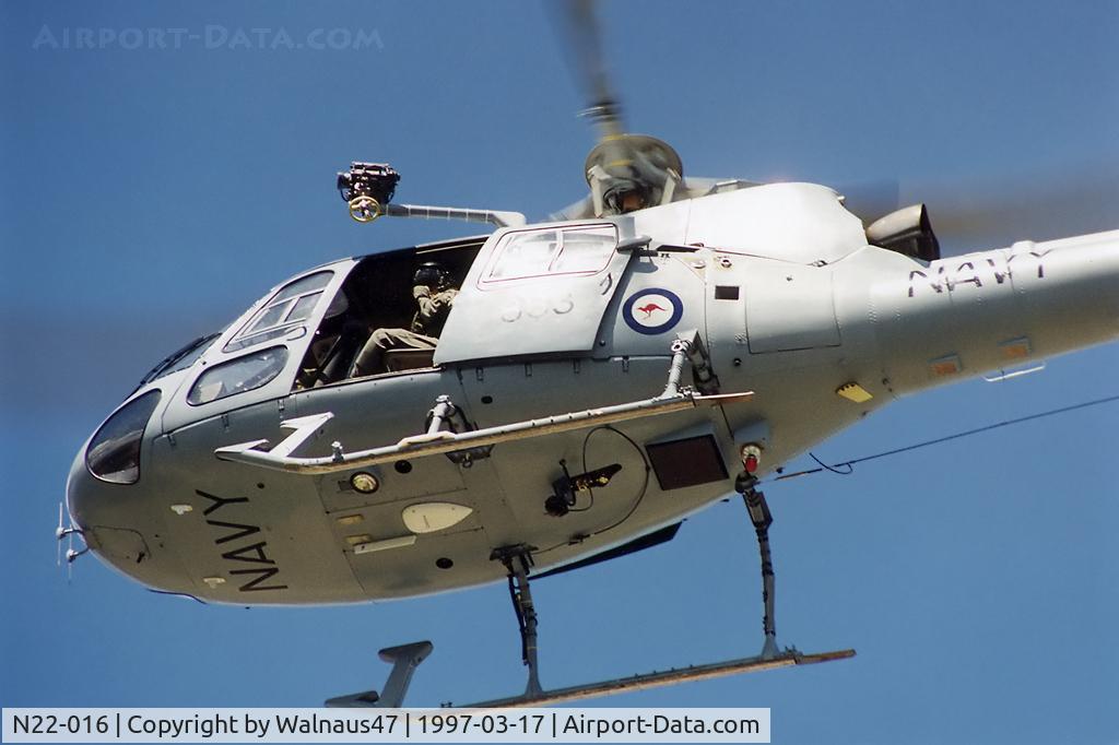 N22-016, Aérospatiale AS-350BA Ecureuil C/N 1740, RAN Squirrel AS-350B helicopter N22-016 Code 863 Cn 1740, from 723 Sqn Nowra, arrives for static display in sunny conditions on the Treasury lawns, Canberra, on 17Mar1997. The occasion was Canberra Day 1997. Front-end underside view of airborne N22-016.