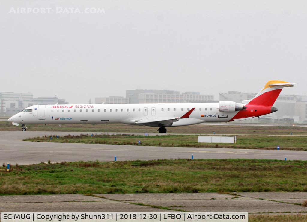 EC-MUG, 2018 Bombardier CRJ-1000 (CL-600-2E25) C/N 19061, Taxiing holding point rwy 32R for departure... full IB c/s this time...