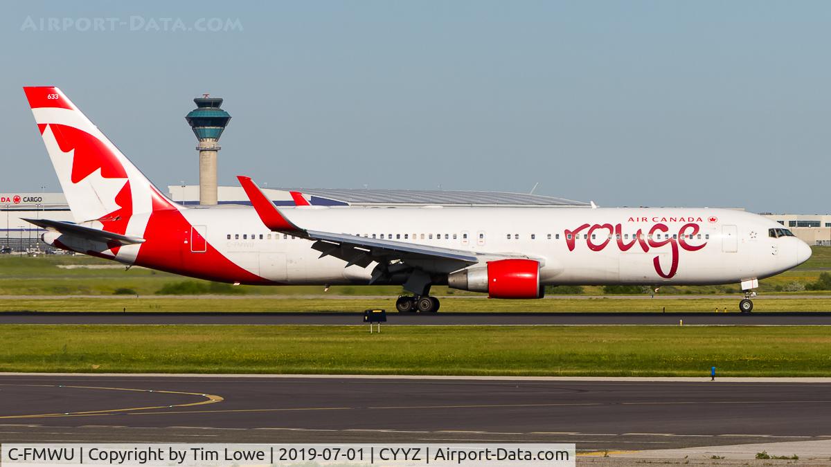 C-FMWU, 1995 Boeing 767-333 C/N 25585, Vacating runway 23 with the CYYZ ATC Tower in the background