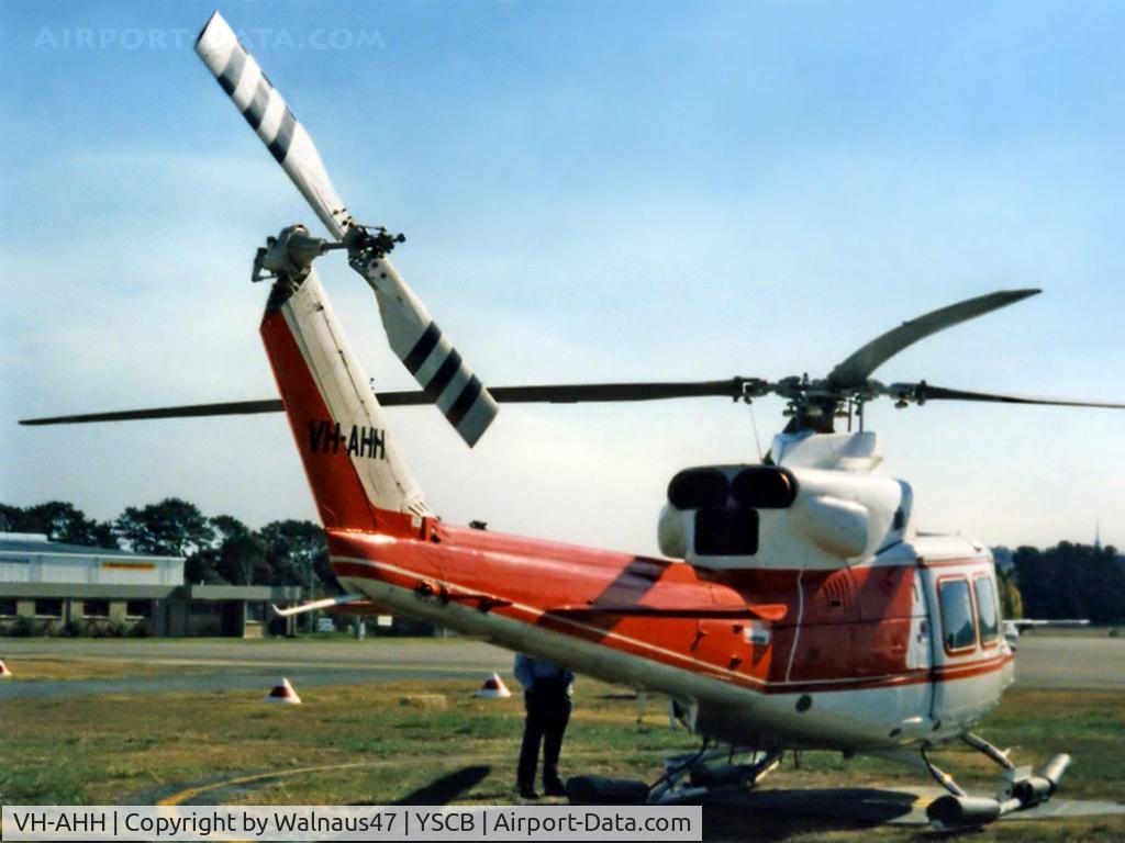 VH-AHH, Bell 412 C/N 33084, Rear Stbd view of parked Bell 412 Helicopter VH-AHH Cn 33084 Code H, photographed at Canberra Airport in Mar 1987. Note pop-out floats on the skids. (Later Regd to NSCA as VH-NSV 16JUN87 - 28MAY89.) Previously Registered as N3172D in USA.