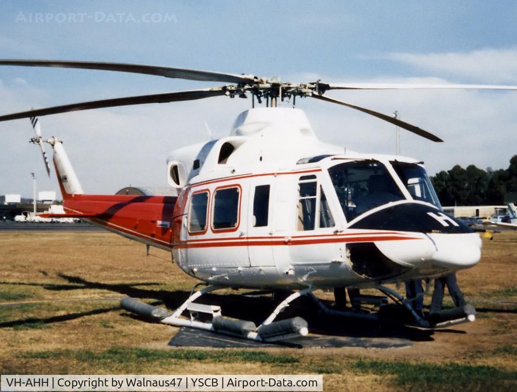 VH-AHH, Bell 412 C/N 33084, Front Stbd view of parked Bell 412 Helicopter VH-AHH Cn 33084 Code H, photographed at Canberra Airport in Mar 1987. Note pop-out floats on the skids. (Later Regd to NSCA as VH-NSV 16JUN87 - 28MAY89.) Previously Registered as N3172D in USA.