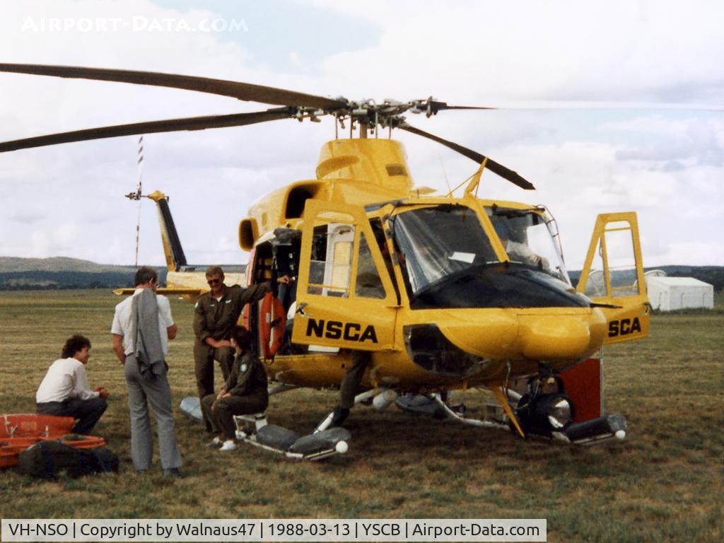 VH-NSO, 1998 Schempp-Hirth Discus 2b C/N 8, NSCA Bell 412EP VH-NSO Cn 33089 (Code 11), with crew at the 1988 (Bi-Centennial) Canberra Air Pageant at Canberra Airport YSCB on 13Mar1988. The Bell 412 is equipped with ‘pop-out’ floats on the skids, and a personnel hoist and Nite-Sun searchlight.