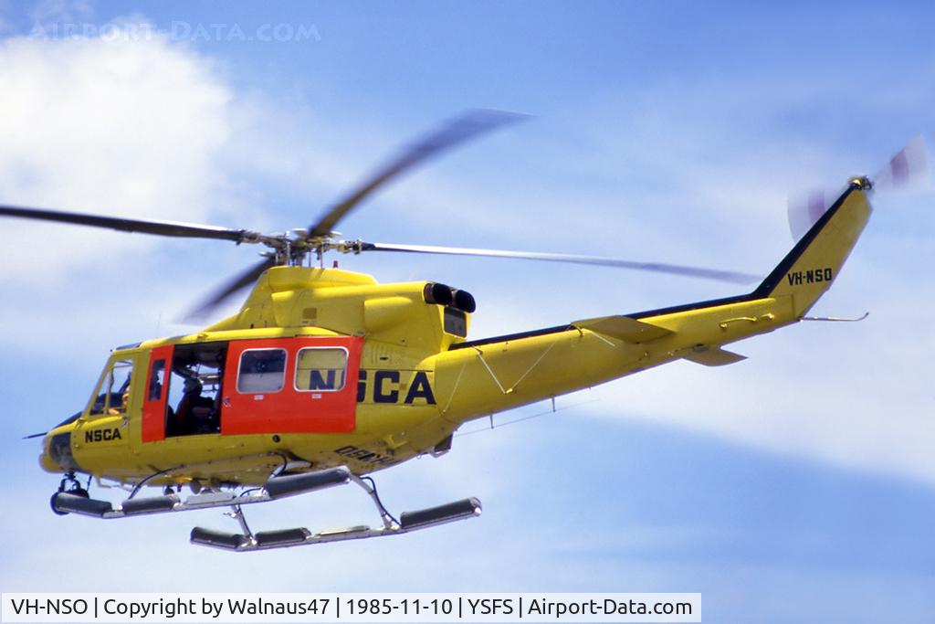 VH-NSO, 1998 Schempp-Hirth Discus 2b C/N 8, Rear Port side view of NSCA Bell 412 VH-NSO Cn 33089 Code 11 flying past at Schofields/ NAS Nirimba (YSFS) on 10Nov1985. The helo is equipped with pop-out floats and a Nite-Sun searchlight. (Helo with NSCA 08MAR85 - 29MAY89 - later Sold to USA as N167EH.)